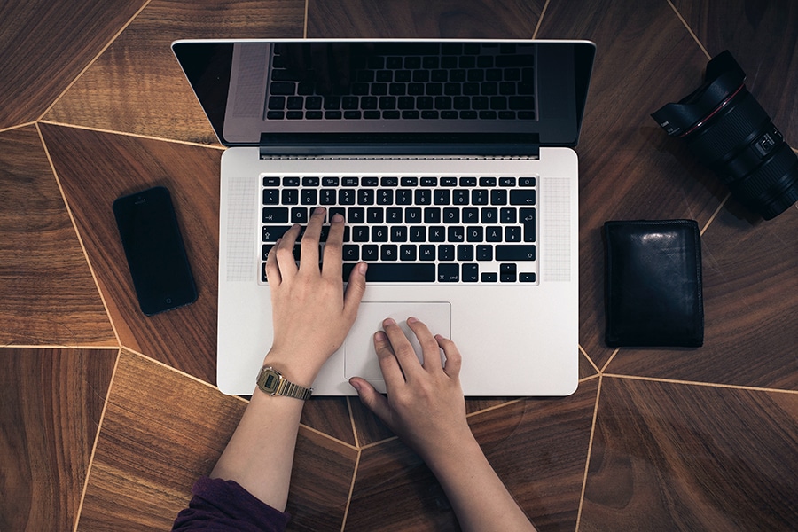Person typing on computer